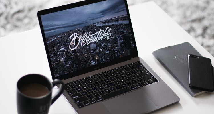 Webdesign on laptop with coffee